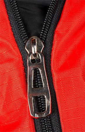 simsearch:693-06020309,k - Red fabric and a chrome zipper opened Stock Photo - Budget Royalty-Free & Subscription, Code: 400-03908988