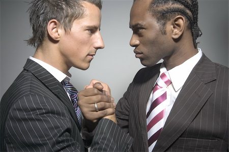 Two suited businessmen faceing each other, Stock Photo - Budget Royalty-Free & Subscription, Code: 400-03909073