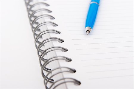 blue pen on white spiral notebook Stock Photo - Budget Royalty-Free & Subscription, Code: 400-03909167