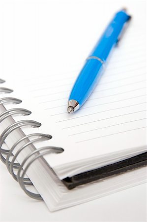 blue pen on white spiral notebook Stock Photo - Budget Royalty-Free & Subscription, Code: 400-03909168