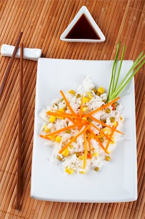 simsearch:622-09176024,k - Salad of rice with sauce and sticks on bamboo mat Photographie de stock - Aubaine LD & Abonnement, Code: 400-03909475