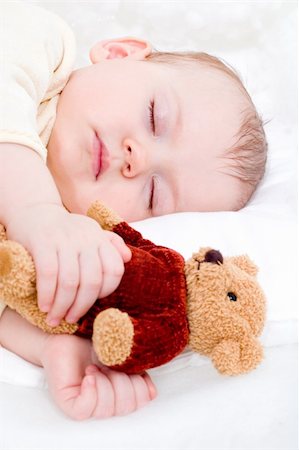 cute little girl sleeping with teddy bear on the white blanket Stock Photo - Budget Royalty-Free & Subscription, Code: 400-03914084