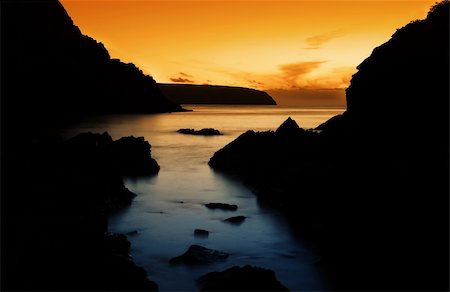 simsearch:400-03914197,k - Rocky Silhouette with beautiful Sunset Photographie de stock - Aubaine LD & Abonnement, Code: 400-03914200