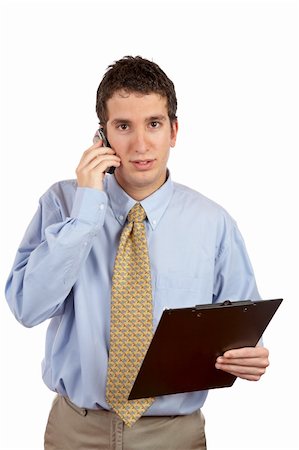 simsearch:400-04963726,k - Serious businessman holding clipboard and talking with cell phone over a white background Stock Photo - Budget Royalty-Free & Subscription, Code: 400-03914539