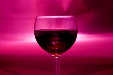 simsearch:695-05771702,k - An artistic interpretation of a dark rose sunset and distant horizon with one focused glass of smoky red wine in the foreground. Fotografie stock - Microstock e Abbonamento, Codice: 400-03915079