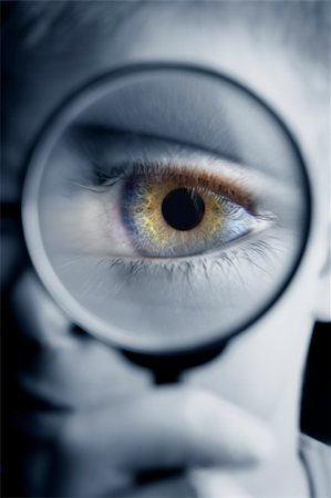 simsearch:700-01695607,k - Boy looking at a tiny object with a magnifying glass. Fotografie stock - Microstock e Abbonamento, Codice: 400-03915084