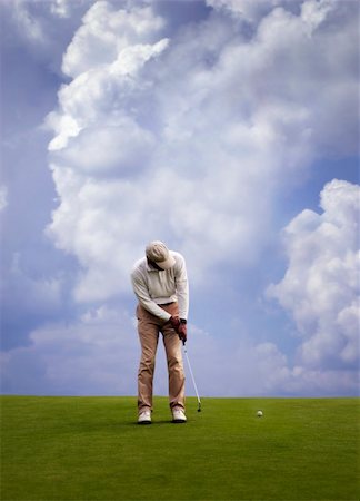 simsearch:400-04319321,k - Man playing golf. Photographie de stock - Aubaine LD & Abonnement, Code: 400-03915085