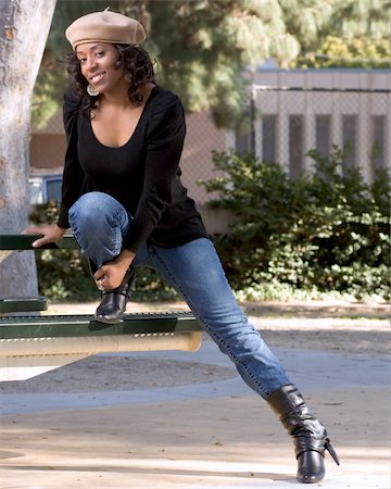 Portrait of African-American girl  in jeans and boots Photographie de stock - Aubaine LD & Abonnement, Code: 400-03915307