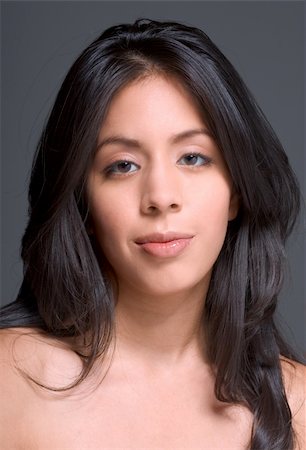smiling young latina models - Portrait of a beautiful Hispanic girl with long hair Photographie de stock - Aubaine LD & Abonnement, Code: 400-03915309