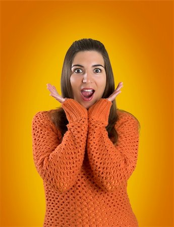 simsearch:400-04635813,k - Beautiful woman with a frendly face on a orange background Stock Photo - Budget Royalty-Free & Subscription, Code: 400-03915488