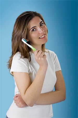 Beautiful woman olding a  tooth brush Stock Photo - Budget Royalty-Free & Subscription, Code: 400-03915491