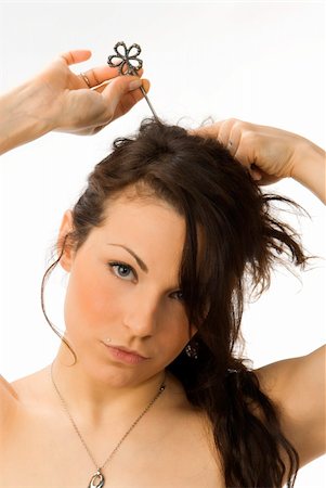 simsearch:400-03916522,k - a nice portrait of a young and cute woman combing her hair Foto de stock - Super Valor sin royalties y Suscripción, Código: 400-03915538