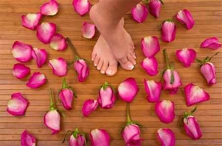 smelling feet - Having spa treatment (pedicured feet surrounded by bright pink roses) Stock Photo - Budget Royalty-Free & Subscription, Code: 400-03915680