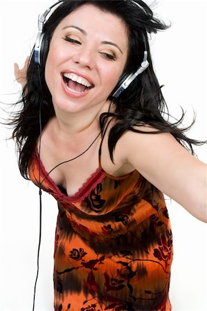 simsearch:400-03915719,k - A spirited girl dances to music Foto de stock - Royalty-Free Super Valor e Assinatura, Número: 400-03915718