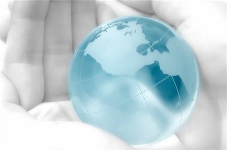 environmental safety business - hand holding a blue globe, blurred, dreamy atmosphere Stock Photo - Budget Royalty-Free & Subscription, Code: 400-03915986