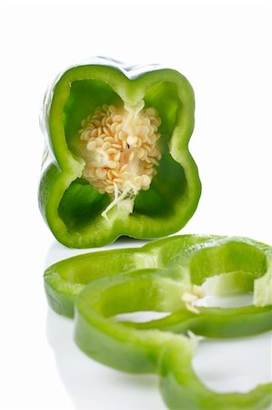 simsearch:400-05065763,k - A fresh and tasty green pepper slices reflected on white background. Shallow DOF and front blurred Stockbilder - Microstock & Abonnement, Bildnummer: 400-03916185