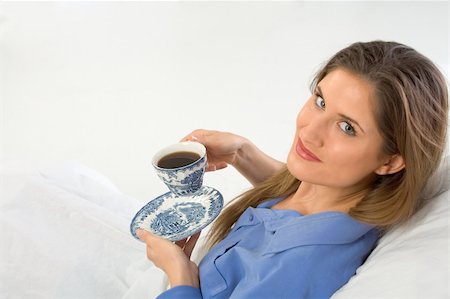 simsearch:693-08127560,k - drinking coffee in the bed female looks up Stock Photo - Budget Royalty-Free & Subscription, Code: 400-03917553