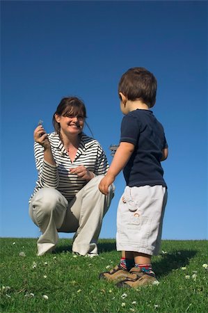 simsearch:400-06452404,k - mother and son having a good time in field over deep blue sky Photographie de stock - Aubaine LD & Abonnement, Code: 400-03917685