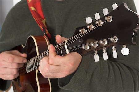 close up of man playing guitare over white background Photographie de stock - Aubaine LD & Abonnement, Code: 400-03917682