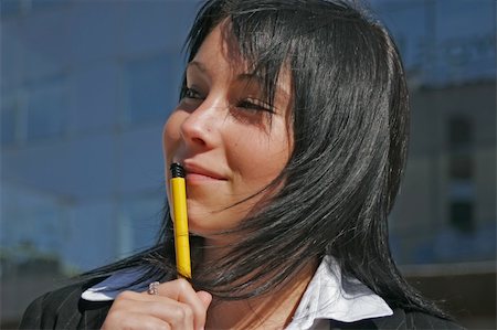 A portrait of a girl with a pen downtown Stock Photo - Budget Royalty-Free & Subscription, Code: 400-03918363
