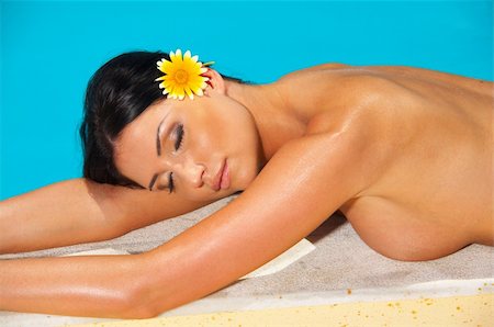 simsearch:6109-06195120,k - Beautiful young Sexy woman laying in bikini during sunbath next to swimming pool Fotografie stock - Microstock e Abbonamento, Codice: 400-03918809