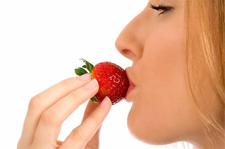 simsearch:693-06021794,k - Close up of a girl eating big reap strawberry Stock Photo - Budget Royalty-Free & Subscription, Code: 400-03918864