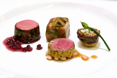 simsearch:400-03989531,k - Seared Australian loin of lamb, shiraz reduction with pomegranate, braised shank and thyme, eggplant zucchini and tomato baked mousaka, artichoke and feta bake with wild garlic chives Stockbilder - Microstock & Abonnement, Bildnummer: 400-03910057