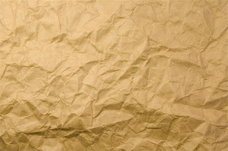 A close-up of a wrinkled brown paper Foto de stock - Super Valor sin royalties y Suscripción, Código: 400-03910684