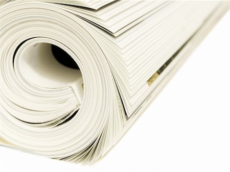 Roll of magazines isolated on a white background Stockbilder - Microstock & Abonnement, Bildnummer: 400-03911035