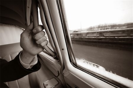 The man's hand keeps for the handle of the automobile. b/w+sepia Stock Photo - Budget Royalty-Free & Subscription, Code: 400-03911212