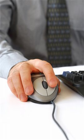 formal mouse computer - Closeup of man's hands with computer mouse and keyboard Stock Photo - Budget Royalty-Free & Subscription, Code: 400-03911221