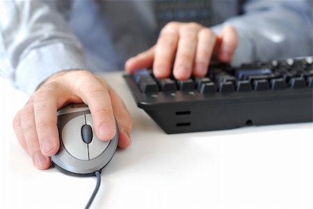 Closeup of man's hands with computer mouse and keyboard Stock Photo - Budget Royalty-Free & Subscription, Code: 400-03911222