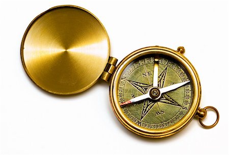 Old style brass compass on white background Fotografie stock - Microstock e Abbonamento, Codice: 400-03911578