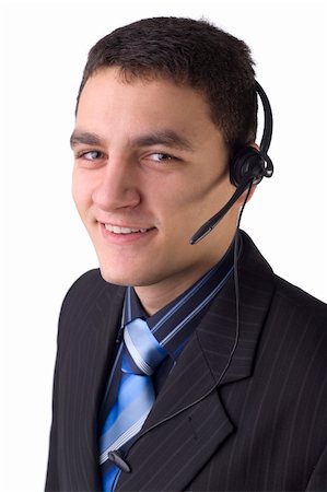 Young man with telephone headset, isolated on white background in studio Stock Photo - Budget Royalty-Free & Subscription, Code: 400-03911846
