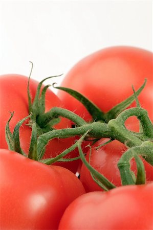simsearch:400-03964348,k - Vine Tomato's set against a plain background Stockbilder - Microstock & Abonnement, Bildnummer: 400-03912115