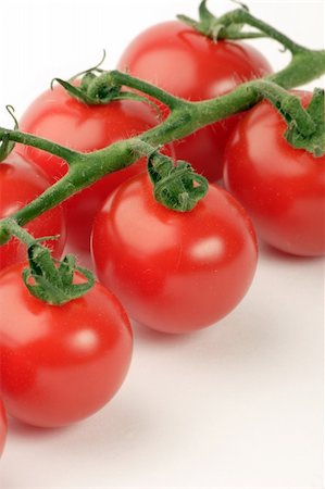simsearch:400-03939080,k - Cherry Tomato's against a plain background Foto de stock - Super Valor sin royalties y Suscripción, Código: 400-03912128