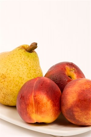 simsearch:400-04433511,k - Necterines and a pear set against a plain background Stock Photo - Budget Royalty-Free & Subscription, Code: 400-03912146