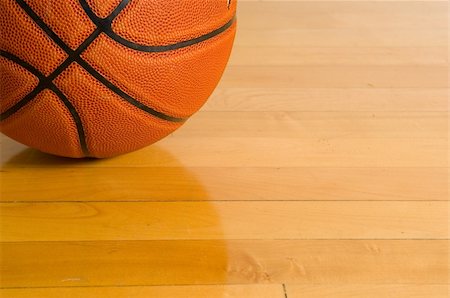 simsearch:694-03319860,k - Leather basketball on wooden gym floor Photographie de stock - Aubaine LD & Abonnement, Code: 400-03912152