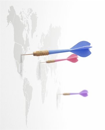 success network - 4 darts on a world map symbol of global business around the planet Photographie de stock - Aubaine LD & Abonnement, Code: 400-03912444