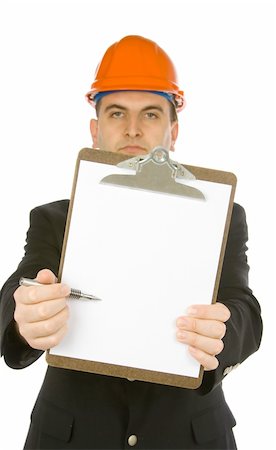 engineer pointing with a pen on a blank paper attached to clipboard Stockbilder - Microstock & Abonnement, Bildnummer: 400-03912721