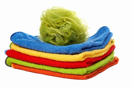 simsearch:400-05296034,k - Multicolour towels stacked and body sponge with soft shadow on white background Stock Photo - Budget Royalty-Free & Subscription, Code: 400-03912914