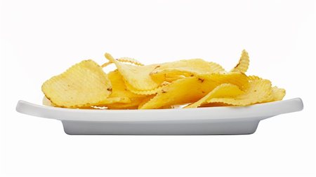 simsearch:696-03394972,k - Potato chips on a plate isolated on white background Stockbilder - Microstock & Abonnement, Bildnummer: 400-03912927