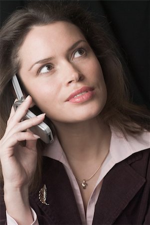 simsearch:400-04291703,k - Pretty brunette secretary with telephone headset Stock Photo - Budget Royalty-Free & Subscription, Code: 400-03913143