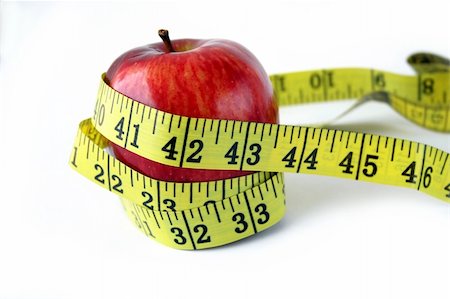 simsearch:400-04271582,k - Apple with measuring tape around in white background Photographie de stock - Aubaine LD & Abonnement, Code: 400-03913467