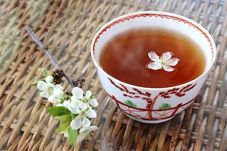 simsearch:400-08186432,k - Tea and blossom; tea in 18th Century chinese porcelain bowl Stock Photo - Budget Royalty-Free & Subscription, Code: 400-03913719