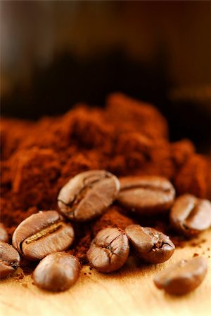 sfregare - Macro image of coffee beans, ground coffee and black coffee cup Fotografie stock - Microstock e Abbonamento, Codice: 400-03913825