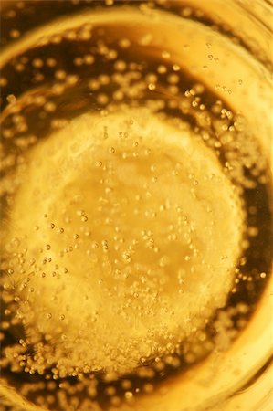 Champagne bubbles rising towards the top of a glass Stock Photo - Budget Royalty-Free & Subscription, Code: 400-03913896