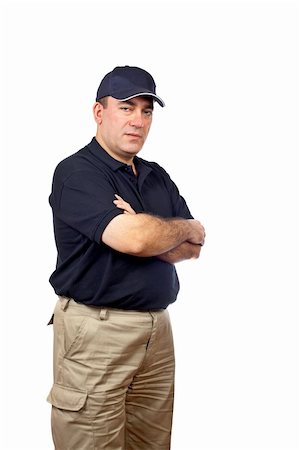 A serious courier standing on white background Stock Photo - Budget Royalty-Free & Subscription, Code: 400-03913905
