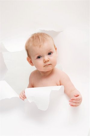 simsearch:400-04436228,k - little cute baby breaking through white paper Stock Photo - Budget Royalty-Free & Subscription, Code: 400-03913911