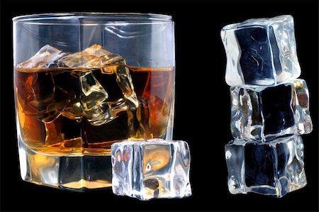 distillation whiskey - Whiskey in tumbler with ice cubes over black Stock Photo - Budget Royalty-Free & Subscription, Code: 400-03913986